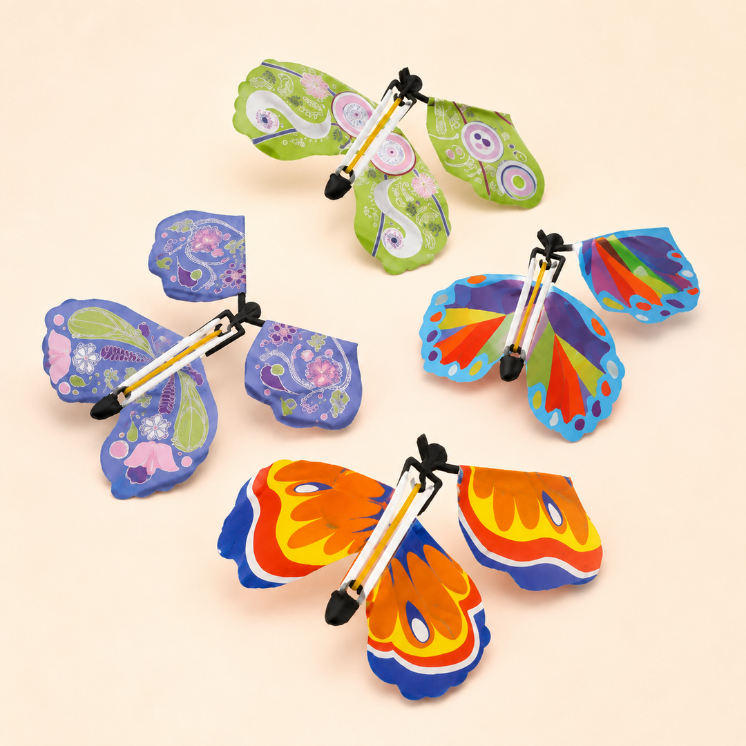 Large close-up of four colorful FlutterWish wind-up flying butterflies